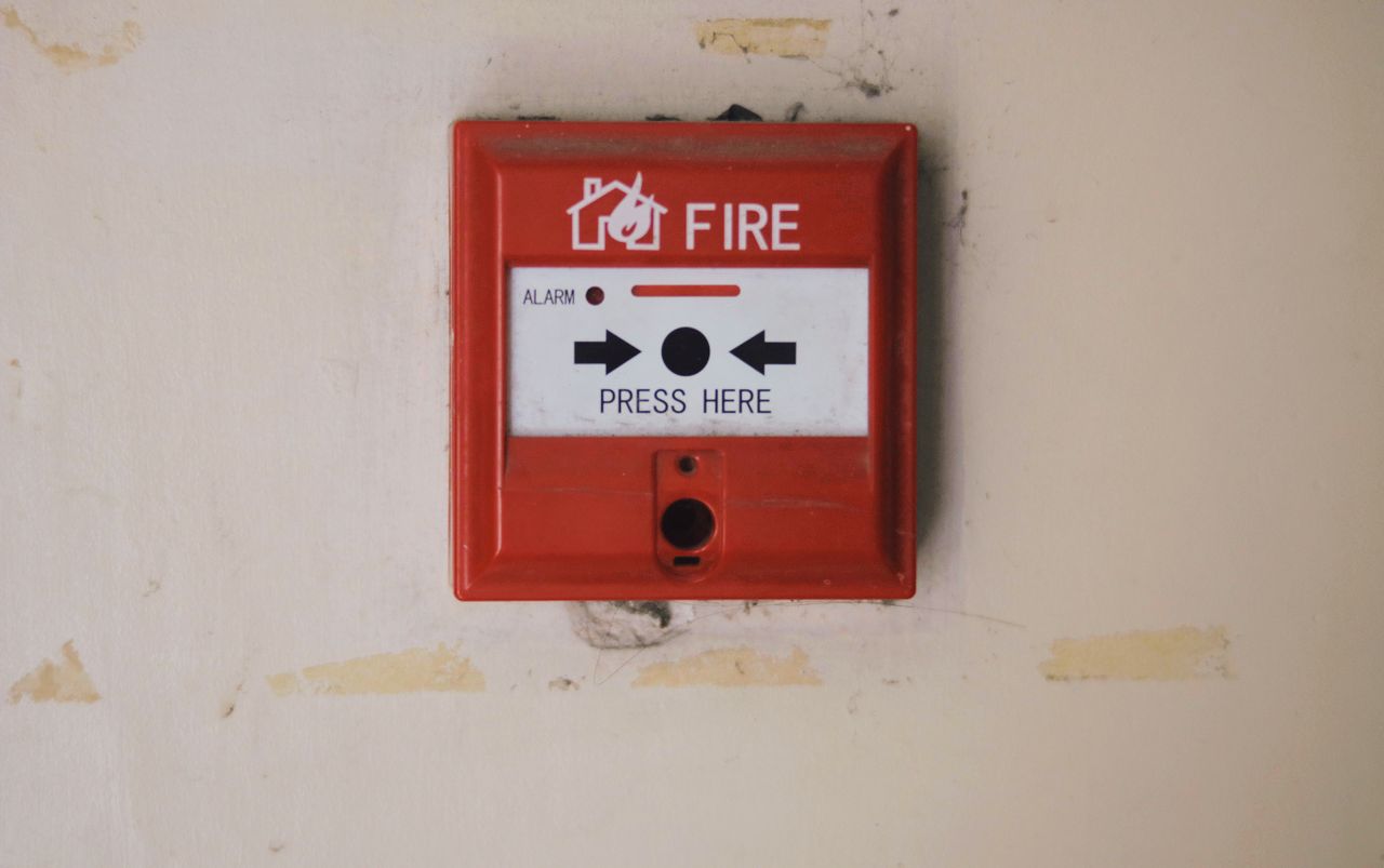 Crafting Captivating Headlines: Your awesome post title goes here Emergency safety fire detection system box for safety with inscription and push button placed on white wall in light room